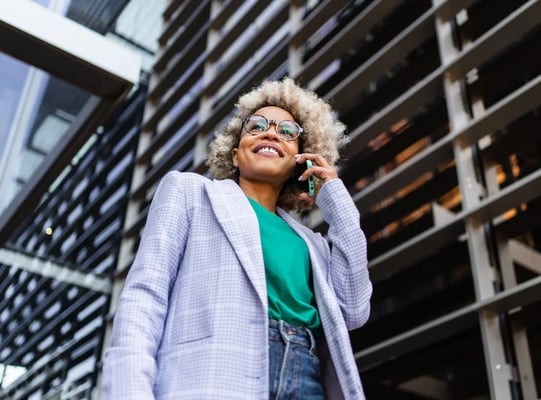 woman working in the city on the phone to a client